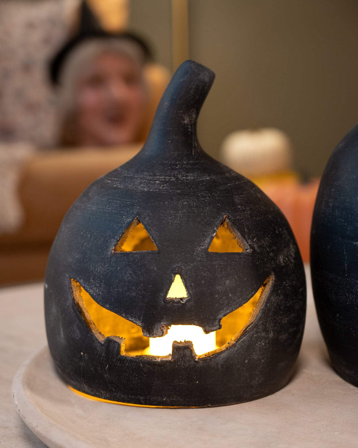 SET OF TWO BLACK CLAY JACK-O-LANTERNS